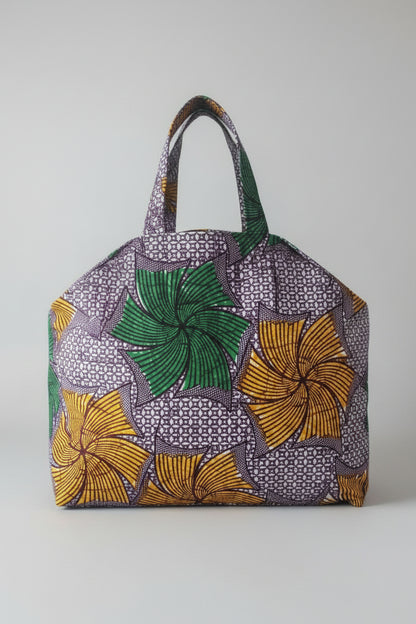 Fans and Dots cotton market bag with green and golden fan motifs on purple-and-white fabric and matching handles.