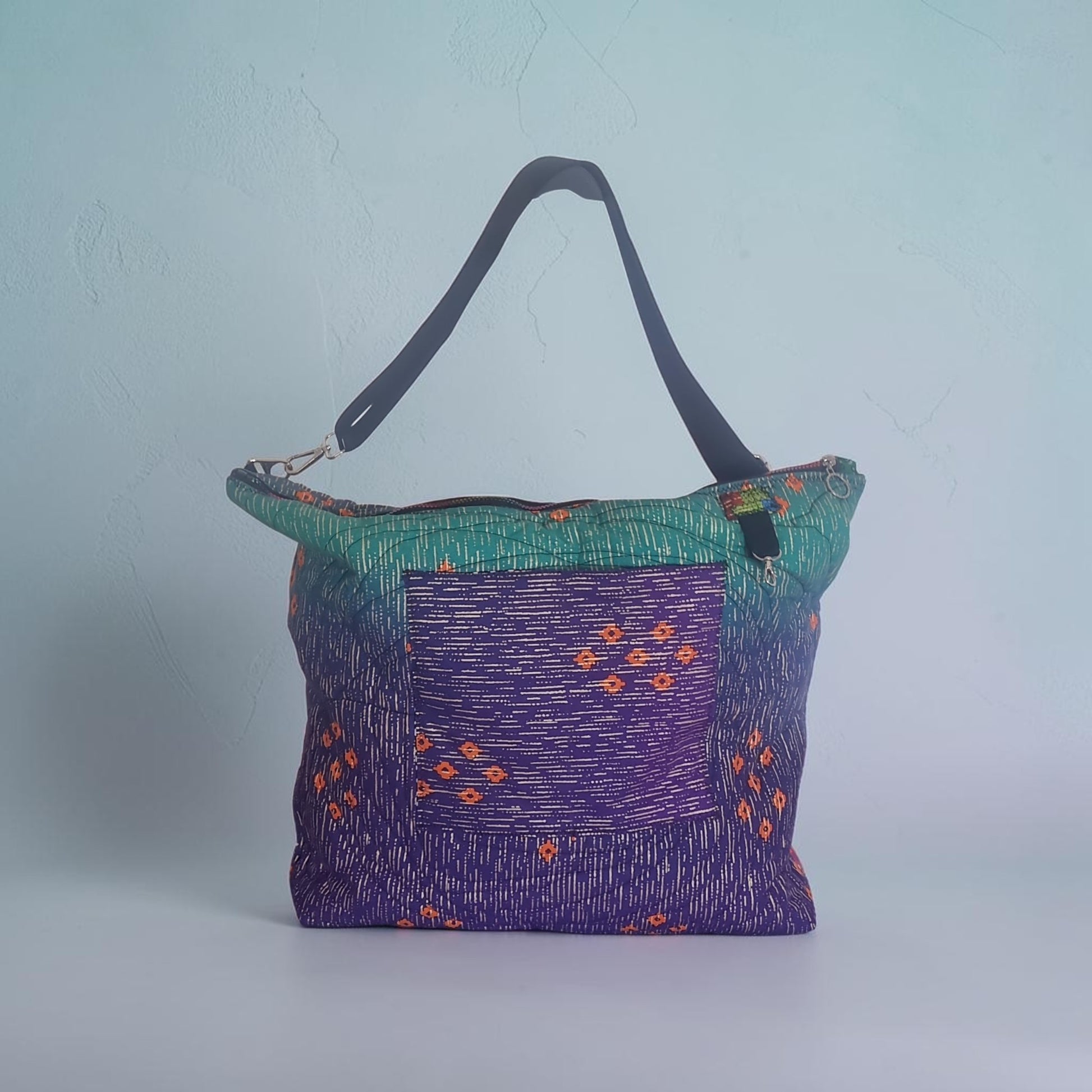 Big Bag Maker quilted shoulder tote in purple and teal with geometric patterns and a sturdy black strap