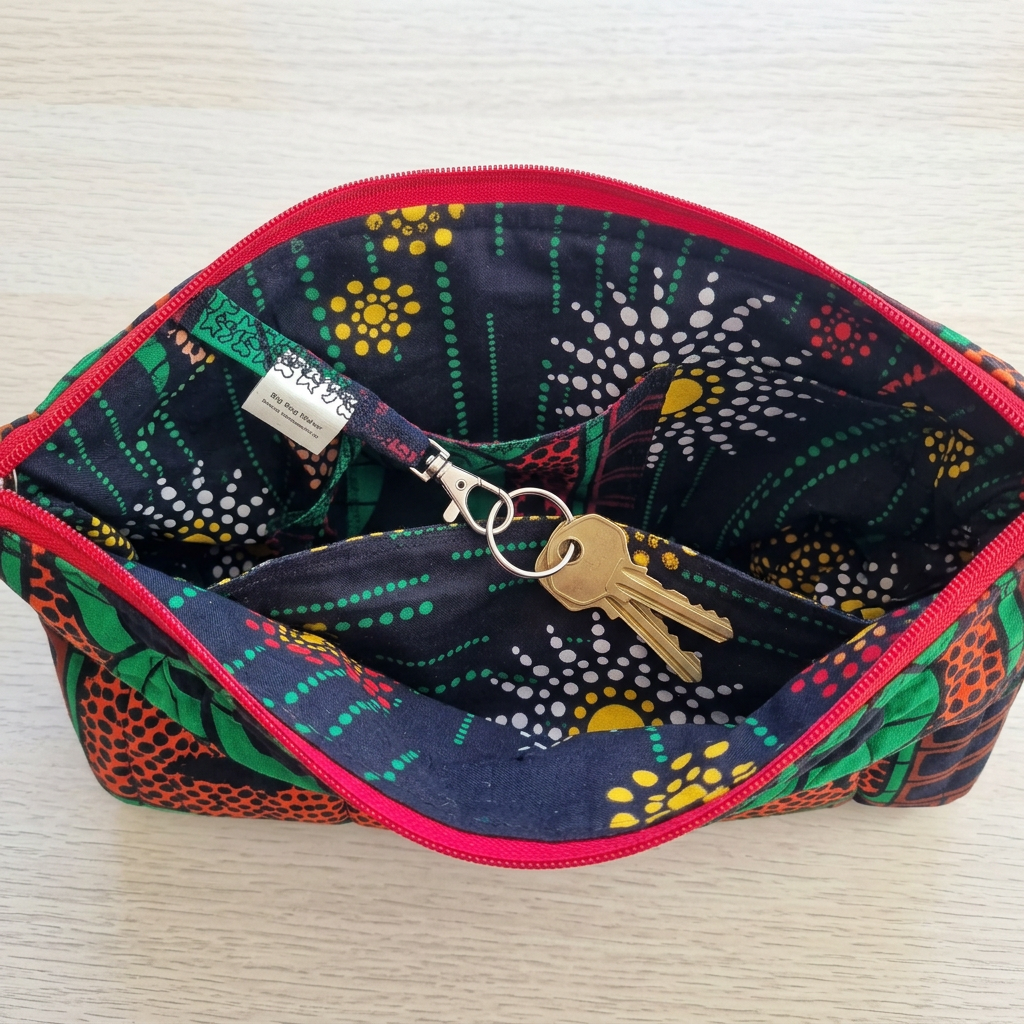Keys attached to the interior swivel clasp inside the Hibiscus & Sunflower bag, beside a lining pocket.