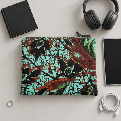 Teal botanical case with a plain book and unbranded gadgets